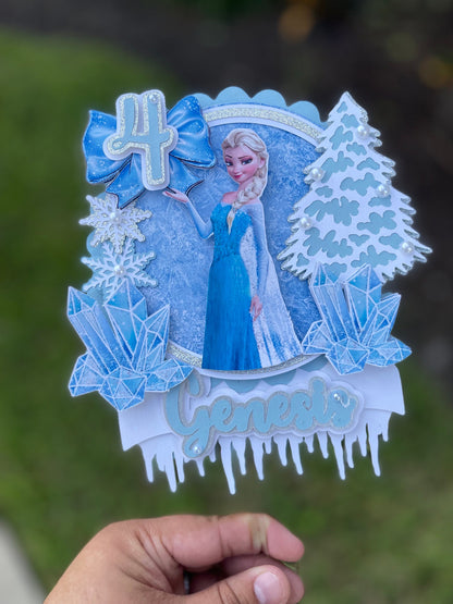 Frozen-themed cake topper. Frozen-inspired topper decoration for parties. Frozen decoration for party.  Sparkling Frozen-themed party decoration. Custom Frozen-themed cake topper . Frozen-inspired  party prop. Shimmery cake topper Elsa themed.