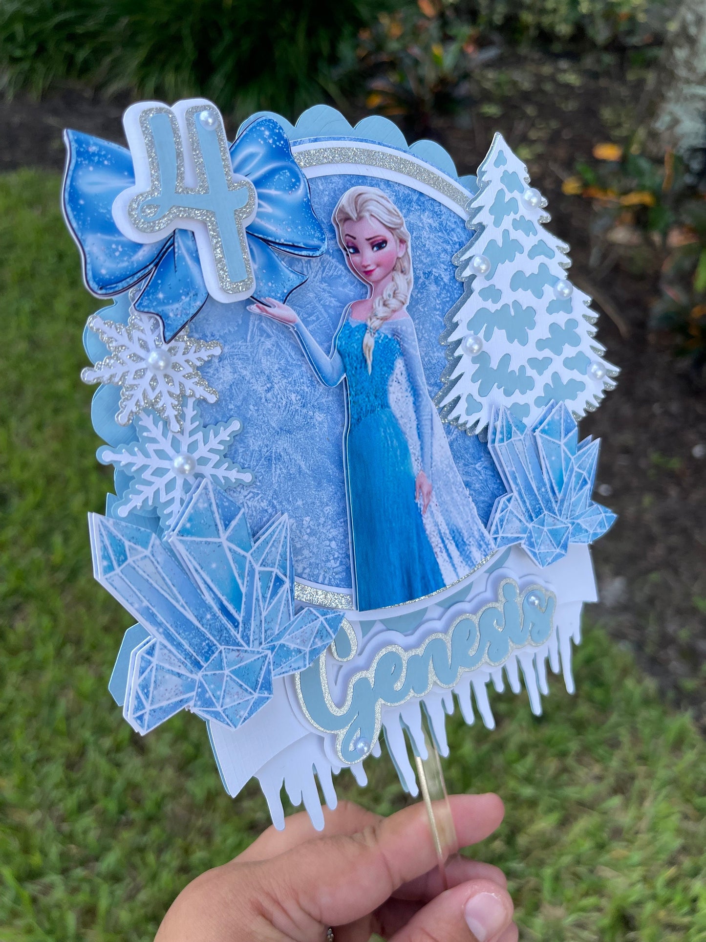 Frozen-themed cake topper. Frozen-inspired topper decoration for parties. Frozen decoration for party.  Sparkling Frozen-themed party decoration. Custom Frozen-themed cake topper . Frozen-inspired  party prop. Shimmery cake topper Elsa themed.