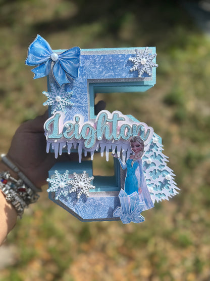 3D Frozen-themed letter party prop. Frozen-inspired letter decoration for parties. Frozen letter prop for themed celebrations. Sparkling Frozen-themed party decoration. Custom Frozen-themed party prop. Frozen-inspired 3D party prop.3D Number .