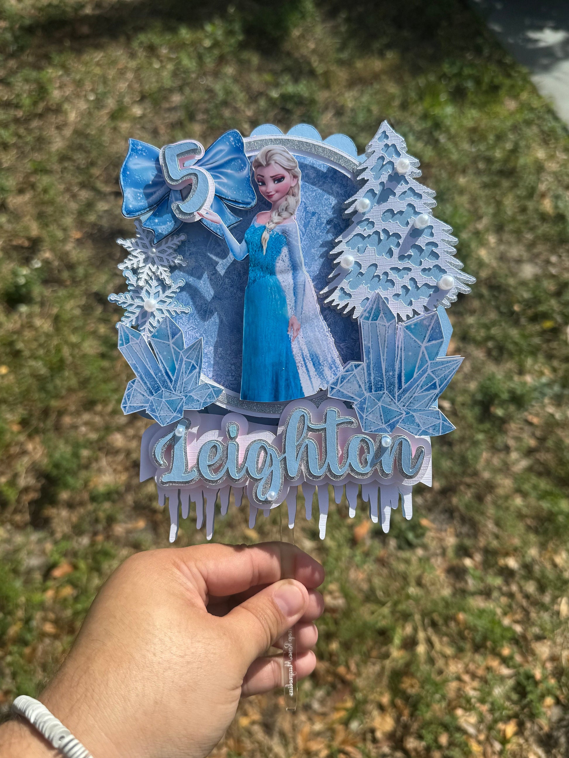 Frozen-themed cake topper. Frozen-inspired topper decoration for parties. Frozen decoration for party.  Sparkling Frozen-themed party decoration. Custom Frozen-themed cake topper . Frozen-inspired  party prop. Shimmery cake topper Elsa themed.