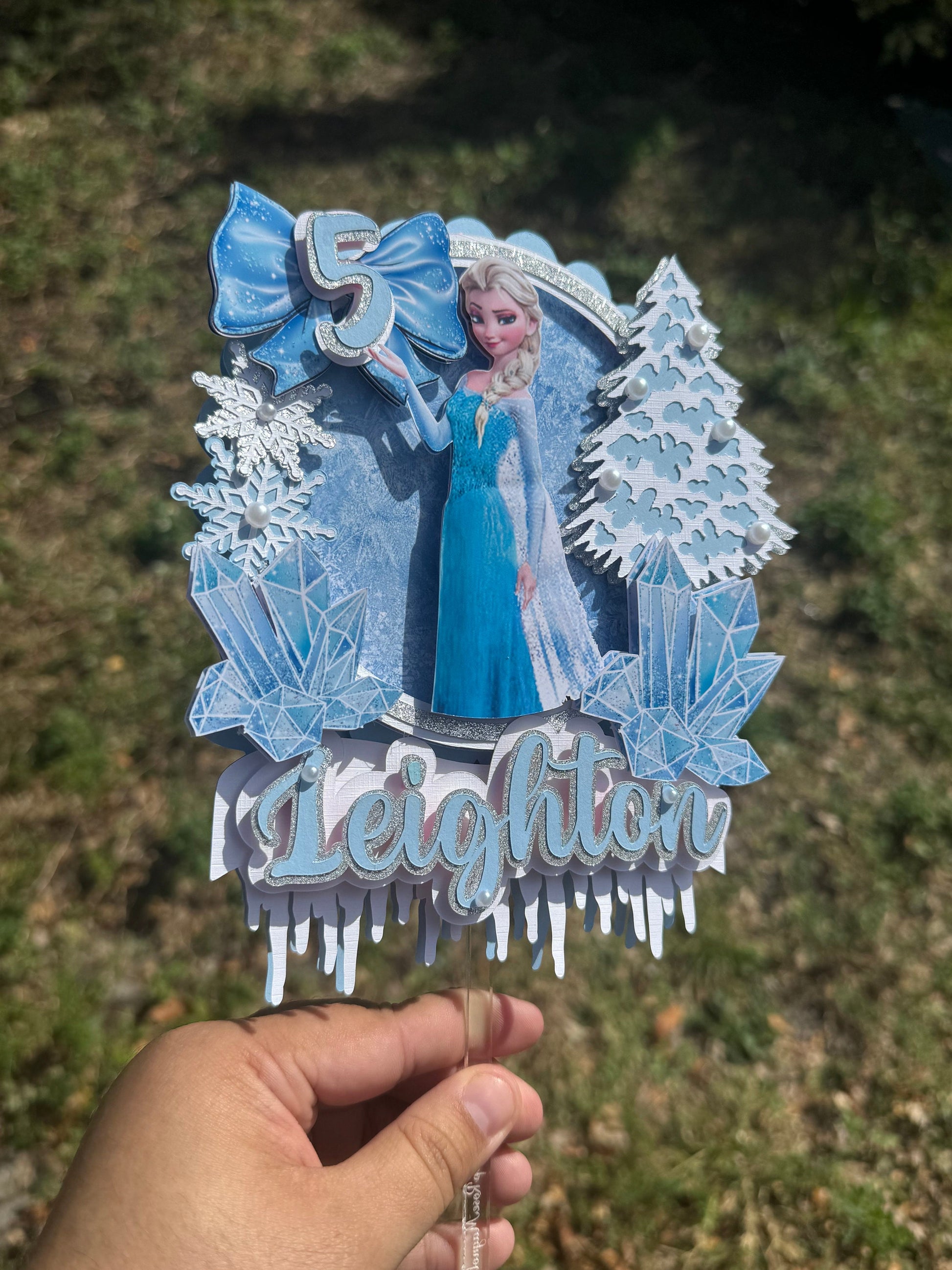 Frozen-themed cake topper. Frozen-inspired topper decoration for parties. Frozen decoration for party.  Sparkling Frozen-themed party decoration. Custom Frozen-themed cake topper . Frozen-inspired  party prop. Shimmery cake topper Elsa themed.